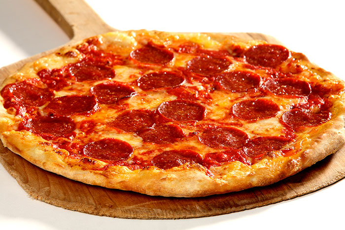 Photo of a large pizza with pepperoni topping