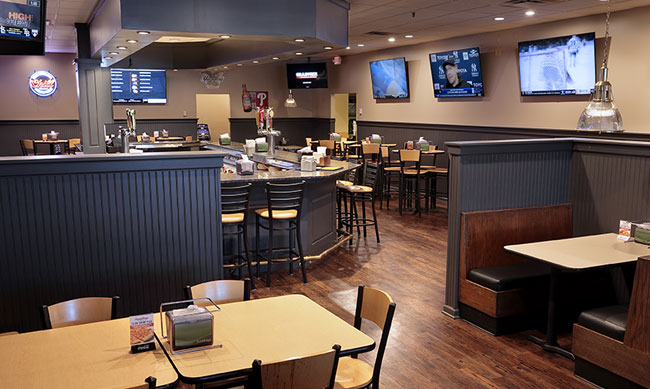 Photo of Grotto Pizza in Edwardsville, PA inside shot of bar & dining area.